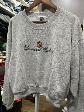 Universal Light Gray Embroidered Crewneck Sweater with Gold Accent